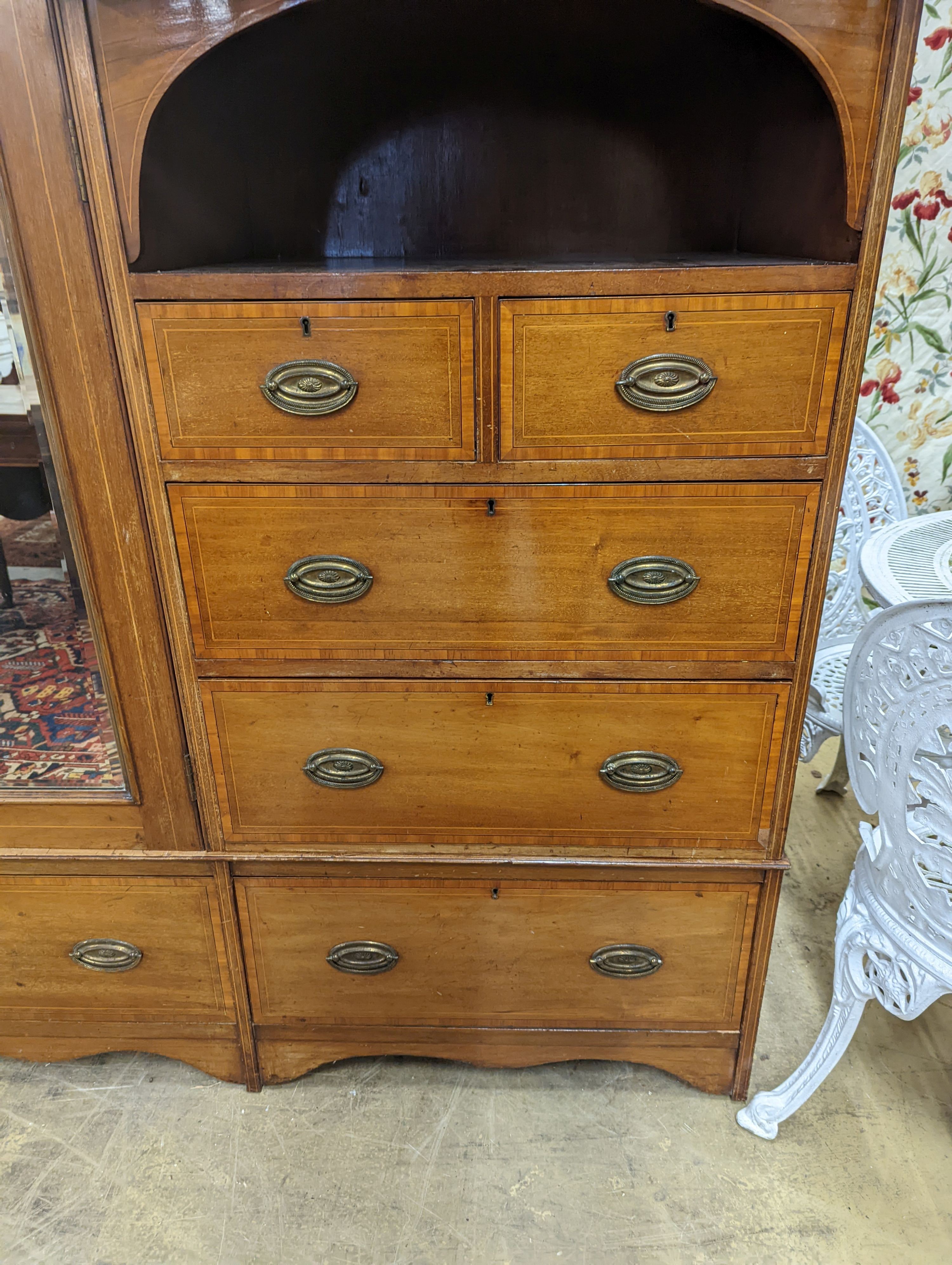 An Edwardian satinwood banded mahogany compactum wardrobe, length 136cm, depth 56cm, height 210cm
